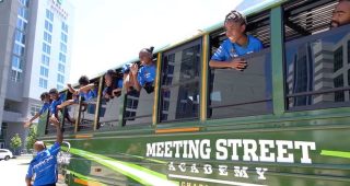 Watch: Kyle Larson gifts school bus to Meeting Street Academy