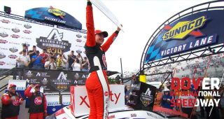 Bell celebrates Dover win with second Dash 4 Cash cardboard check