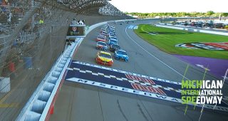 Logano holds off Kurt Busch for Michigan win