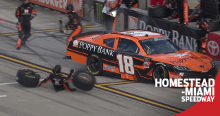 Daniel Hemric has trouble in the pits, tire carrier takes a tumble