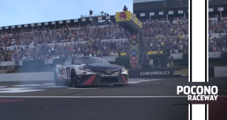 Burnout: Denny smokes out the frontstretch at Pocono Raceway