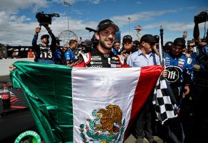 SONOMA, CALIFORNIA - JUNE 12: Daniel Suarez, driver of the #99 Onx Homes/Renu Chevrolet, celebrates with a Mexican flag after winning the NASCAR Cup Series Toyota/Save Mart 350 at Sonoma Raceway on June 12, 2022 in Sonoma, California. (Photo by Chris Graythen/Getty Images) | Getty Images