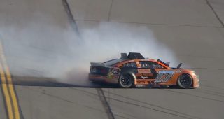 Byron push sends leader Buescher into inside wall late