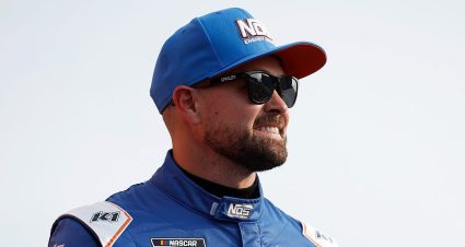 Ricky Stenhouse Jr. looks on.