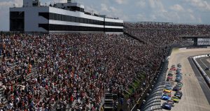 NASCAR Cup Series cars race to the start-finish line on May 11, 2025 at Kansas Speedway.