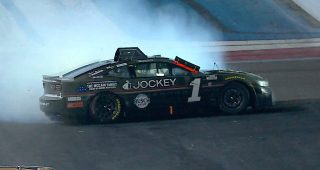 Chastain spins after late contact in Coca-Cola 600