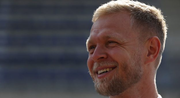 Kevin Magnussen looks on at a race.