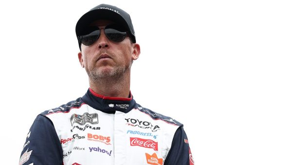 Denny Hamlin looks on.