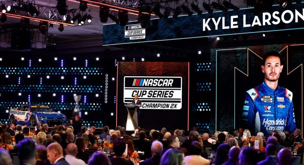 2025 NASCAR Cup Series champion Kyle Larson speaks on stage during the NASCAR Awards in Scottsdale, Arizona.