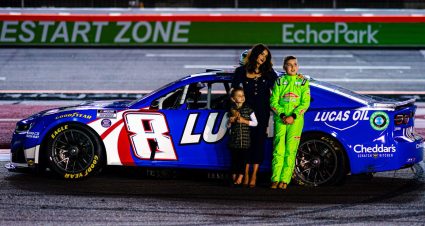 Samantha Busch, Brexton Busch and Lennix Busch stand next to Kyle Busch's car during a celebration of life for Kyle Busch.