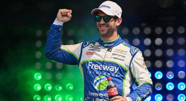 Spire Motorsports driver Daniel Suárez pumps his fist during NASCAR driver intros.