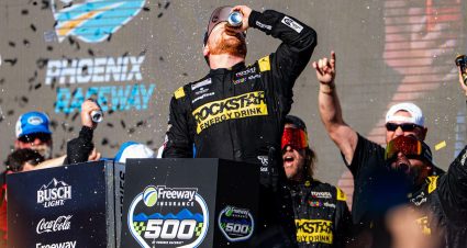 Tyler Reddick chugs a drink after winning a NASCAR Cup Series Chase race at Phoenix.